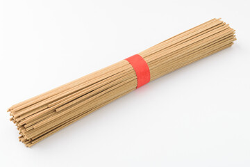 Buckwheat noodles on a white background