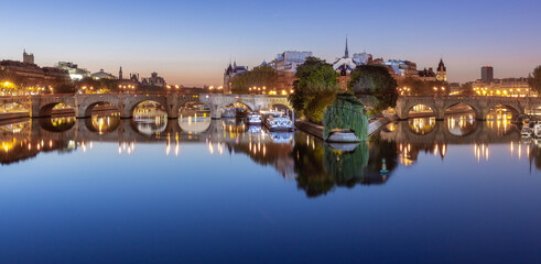 Paris. City embankment along the Seine river at dawn.