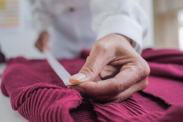 Tailor woman working in tailor shop Stylish Fashion designer tailor in workshop studio designing new collection Dressmaking and Creative.fashion collection&nbsp;