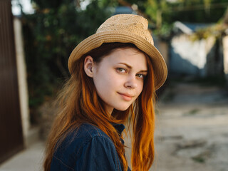 Happy woman in hat red hair shirt model countryside 