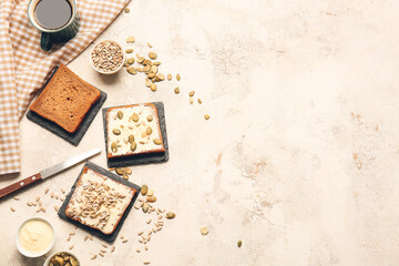 Composition with fresh bread, butter and seeds on light background
