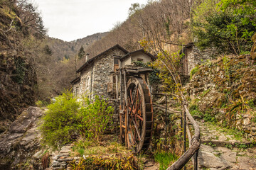 Landscape view of the mountain town of Intragna with an old mild as main subject, shot in Centovalli, Ticino, Switzerland