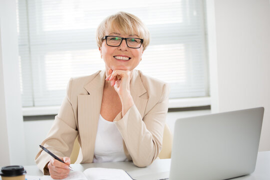 Portrait of senior business woman working in an office