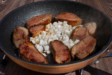 Duck breast fillet in a pan, fried with garlic, special asiatic recipe