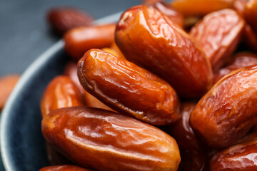 Bowl with sweet dried dates, closeup