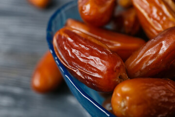 Bowl with sweet dried dates, closeup