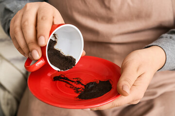 Woman reading coffee grounds, closeup