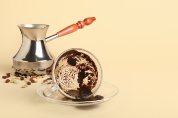 Jezve and cup with spent coffee grounds for fortune telling on color background