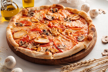 Fresh baked chicken and mushroom pizza on the white background