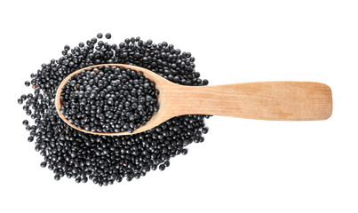 Spoon with black lentils on white background