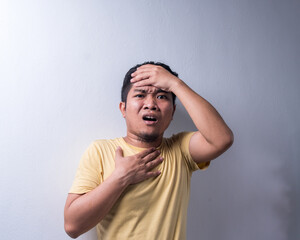 Face reaction, Asian young man portrait of face expression, shocked, thrilled, scared, surprised, with covered face with hand. Isolated, selective focus, copy space