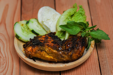 Ayam Penyet / grilled chicken, this food is a traditional food from Java made from grilled chicken with spicy shrimp paste.