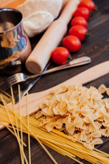italian cuisine pasta cooking wood table lunch tomatoes