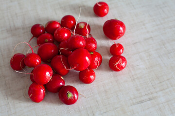 large horizontal photo. vitamins. Healthy eating. ECO. Seasonal vegetables. Pink radish on a white table. Ripe fruits of red radish without green leaves.
