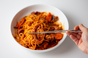 Spicy Squid Stir Fry which is called Ojingeo Bokkeum with thin white noodle