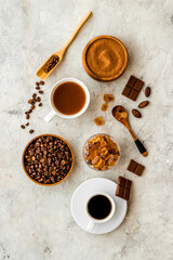 Top view of diffetent varieties of coffee beans with hot drink, top view