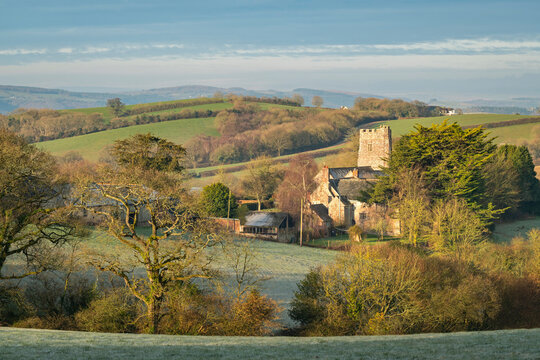 Church of St. John the Baptist at Holcombe Burnell Barton, surrounded by countryside in winter, Longdown, Devon, England, United Kingdom