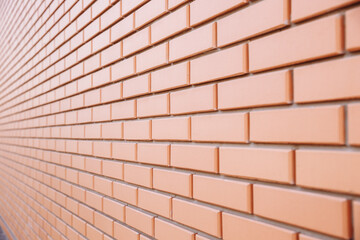 Obraz premium New red brick. Side view of a red brick wall