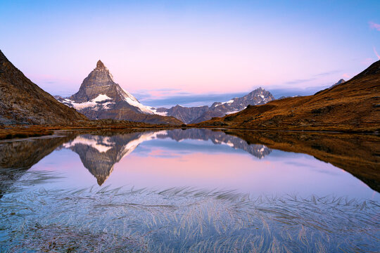 Matterhorn reflected in Riffelsee lake at dawn, Gornergrat, Zermatt, canton of Valais, Switzerland