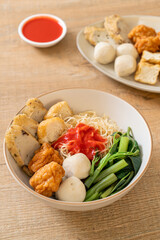 egg noodles with fish balls and shrimp balls in pink sauce, Yen Ta Four or Yen Ta Fo