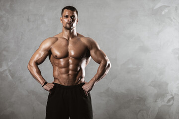 Fitness in gym, sport and healthy lifestyle concept. Handsome athletic man with naked torso...