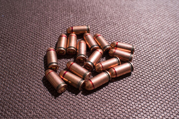 Close-up shot of a bullet for a firearm. Bullets for the pistol