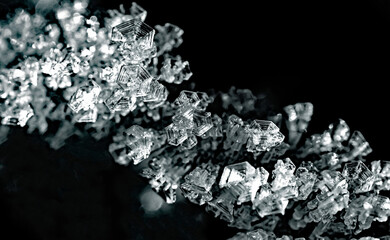 Natural ice crystals frostwork on black backround. Macro closeup.
