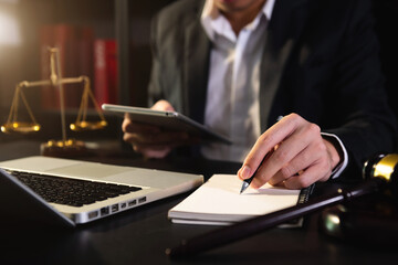 business people and lawyers discussing contract papers sitting at the table.