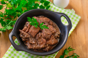 Lamb stew with red wine gravy, carrots and onions