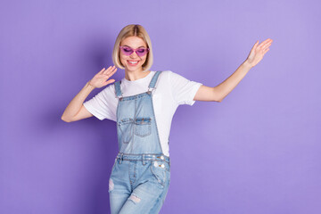 Photo of nice optimistic short hairdo blond lady dance wear spectacles white t-shirt isolated on violet background