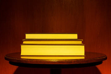 Academic books illuminated with golden light