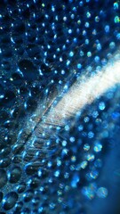 vertical aspect ratio, blue bokeh light effect, water blurred highlights, abstract image background...