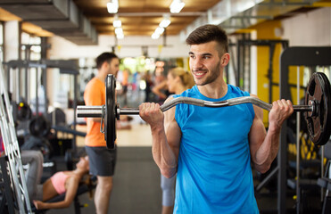 Fototapeta na wymiar Fitness, sport, training, gym and lifestyle concept. Group of smiling people exercising in the gym