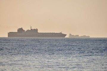 ferries and ships on the horizon on the open sea