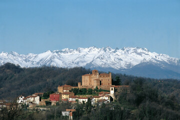 Fototapeta na wymiar the ancient village of Bardassano with tower and castle on the hills near Turin and the Alps in Piedmont