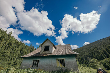 A house with a mountain in the background
