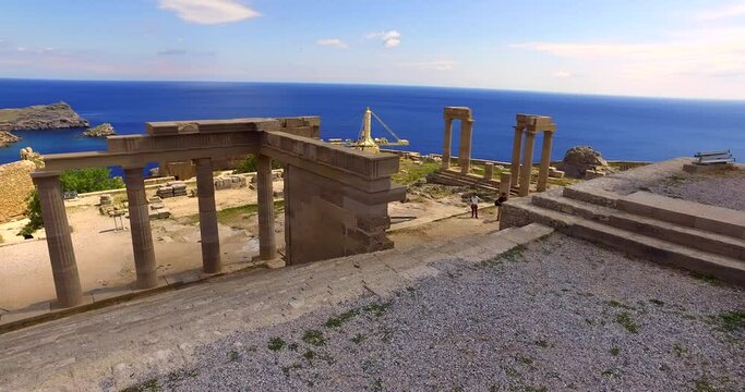 Lindos is the most impressive archaeological site on Rhodes. with the Lindos Acropolis rising dominantly on a steep cliff overlooking the sea, framed by mighty fortress walls.