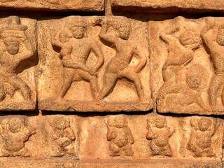 Bas relief ancient sculptures carved on the walls of historical Brihadeeswarar temple in Thanjavur, Tamilnadu. Indian rock art relief carvings of ancient God sculptures in temple walls in Tamilnadu.