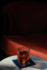Negroni, an italian IBA cocktail with gin, bitter and vermouth; in luxury elegant home, homemade...