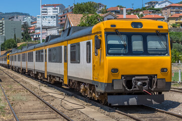 Fototapeta na wymiar Front view of a regional train, typical of the Portuguese train network, at the train station in the city of Peso da Regua