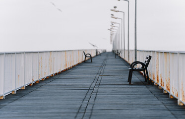 wooden bridge in the fog over the sea. Pier. 