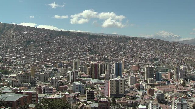 Panoramic View of the City of La Paz and the Hernando Siles Stadium, one of the Highest Professional Stadiums in the World, with Mt Illimani Behind, Bolivia, South America. 4K Resolution.