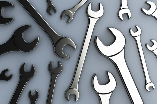Lots of open-end wrenches on the table. Top view. Repair topics.