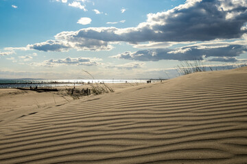 South of France beach at sunset with cloudy sky in the background, shot near Agde, Herault, France