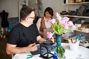 Two colleagues working together in the workshop