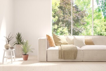 White living room with sofa and summer landscape in window. Scandinavian interior design. 3D illustration