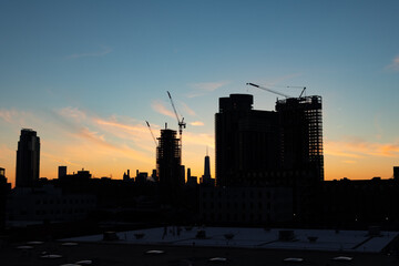 Rooftop Skyline Silhouette view with Skyscrapers and Construction in Greenpoint Brooklyn New York and Manhattan