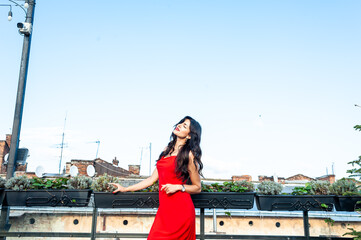 Woman wearing red dress outdoor