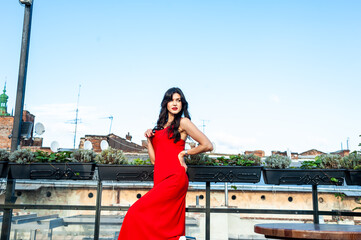 Woman wearing red dress outdoor