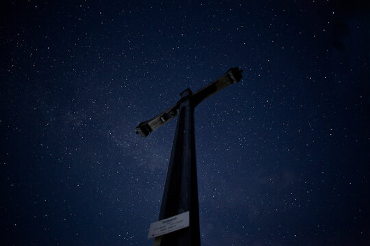 Summit cross at night, Rotwand mountain, Bavaria, Germany